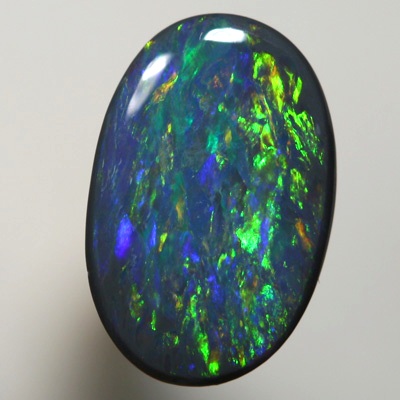 SOLID BLACK OPAL Strong gold copper fire. SEE VIDEO